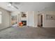 Bright living room with fireplace and sliding glass door to patio at 750 Copper Ln # 102, Louisville, CO 80027