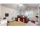 Cozy bedroom with a lofted bed, study area, and a ceiling fan at 5448 El Diente St, Golden, CO 80403