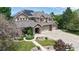 Inviting two-story home with a three-car garage, solar panels, and well-maintained front yard with a fountain at 5448 El Diente St, Golden, CO 80403