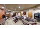 Spacious living room in basement with comfortable seating and a fireplace at 5448 El Diente St, Golden, CO 80403