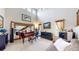 Bright living room with a grand piano, high ceilings, and ample natural light at 5448 El Diente St, Golden, CO 80403