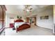 Serene primary bedroom with vaulted ceilings, ample natural light, and classic wood furniture at 5448 El Diente St, Golden, CO 80403