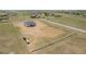 A sprawling home with a three-car garage sits on a large lot enclosed with fencing at 56159 E Tomahawk Ave, Strasburg, CO 80136