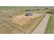 A expansive lot with a house and a three-car garage, fenced for privacy and security at 56159 E Tomahawk Ave, Strasburg, CO 80136