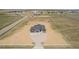 Sprawling home with three-car garage sits on a large lot surrounded by fencing at 56159 E Tomahawk Ave, Strasburg, CO 80136