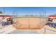 An outdoor baseball field with chain-link fencing and multiple bleachers and benches at 56159 E Tomahawk Ave, Strasburg, CO 80136