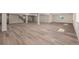 Unfinished basement offers a large space with light wood flooring and natural light at 56159 E Tomahawk Ave, Strasburg, CO 80136
