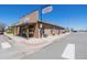 A commercial building featuring a sign that says 'The Shoppes On Main' at 56159 E Tomahawk Ave, Strasburg, CO 80136