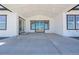 Covered patio with concrete and steps offers an inviting outdoor living space at 56159 E Tomahawk Ave, Strasburg, CO 80136