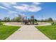 Well-equipped playground with slides, climbing structures, and benches for parents at 56159 E Tomahawk Ave, Strasburg, CO 80136