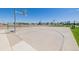 Outdoor basketball court with well-maintained concrete surface and equipment at 56159 E Tomahawk Ave, Strasburg, CO 80136
