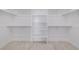 Walk-in closet with built-in shelving and ample storage space for an organized wardrobe and accessories at 56159 E Tomahawk Ave, Strasburg, CO 80136