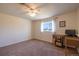 Bedroom featuring neutral walls, a work desk, plush carpeting, and natural light from the window at 971 Elm Pl, Thornton, CO 80229