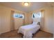 Simple bedroom with neutral walls, carpet, and natural light, creating a peaceful atmosphere at 971 Elm Pl, Thornton, CO 80229