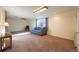 Comfortable living area with carpet and window view at 971 Elm Pl, Thornton, CO 80229