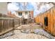 View of the backyard with fence and steps at 2992 Hooker St, Denver, CO 80211