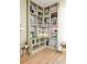 Custom built-in bookcase provides ample shelving for books and decor with reading nook at 2992 Hooker St, Denver, CO 80211