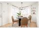 Cozy dining room with round table, stylish chairs, and natural light at 2992 Hooker St, Denver, CO 80211