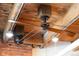 Close-up view of the unique ceiling fan and exposed wooden beams, showcasing industrial-chic design elements at 1801 Wynkoop St # 518, Denver, CO 80202
