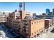 Beautiful exterior of building showing brick facade and view of downtown skyline at 1801 Wynkoop St # 518, Denver, CO 80202