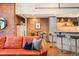 Cozy living area showcasing exposed brick, a modern kitchen, and contemporary seating, perfect for entertaining at 1801 Wynkoop St # 518, Denver, CO 80202