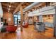 Spacious living room featuring an open floor plan, modern furnishings, and an industrial-chic aesthetic at 1801 Wynkoop St # 518, Denver, CO 80202