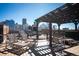 Relaxing rooftop deck with city views, featuring lounge chairs and a pergola for outdoor enjoyment at 1801 Wynkoop St # 518, Denver, CO 80202