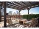 Inviting rooftop deck features wooden pergola, lounge seating and fantastic views of city skyline at 1801 Wynkoop St # 518, Denver, CO 80202