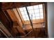 An interior featuring a skylight with exposed wood beams and piping, highlighting the architectural detail at 1801 Wynkoop St # 518, Denver, CO 80202