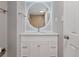 Bright bathroom featuring a round, lighted mirror above a vanity with white cabinets at 850 20Th St # 503, Boulder, CO 80302