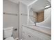 Bright bathroom featuring a round, lighted mirror above a vanity with a marble countertop at 850 20Th St # 503, Boulder, CO 80302