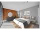 Bright bedroom with a brick accent wall featuring neutral paint and carpet at 850 20Th St # 503, Boulder, CO 80302