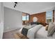 Bright bedroom featuring a brick accent wall and a sliding glass door leading to a balcony at 850 20Th St # 503, Boulder, CO 80302