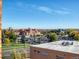 Scenic city view showcases an attractive building with parking and distant landscapes under a clear sky at 850 20Th St # 503, Boulder, CO 80302