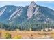 Scenic Flatirons view with fall colors and surrounding foliage at 850 20Th St # 503, Boulder, CO 80302