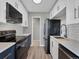 Updated kitchen with white cabinets, stainless steel appliances, and stylish fixtures at 850 20Th St # 503, Boulder, CO 80302