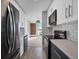 Modern kitchen with stainless steel appliances and stylish fixtures open to the living area at 850 20Th St # 503, Boulder, CO 80302