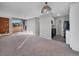 Open-concept living room with carpet and a view to the kitchen and balcony at 850 20Th St # 503, Boulder, CO 80302