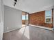 Living space featuring a brick wall and sliding doors leading to a balcony at 850 20Th St # 503, Boulder, CO 80302