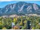 Expansive views feature the majestic Flatirons rising over the fall foliage and neighborhood homes at 850 20Th St # 503, Boulder, CO 80302