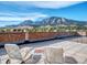 Relax on this rooftop patio offering scenic mountain views and outdoor seating under a sunny sky at 850 20Th St # 503, Boulder, CO 80302