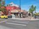 Street view of local businesses, showcasing outdoor seating areas under the bright, sunny sky at 850 20Th St # 503, Boulder, CO 80302