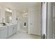 Bathroom featuring a glass shower, double vanity, and neutral color palette at 18813 E 99Th Ave, Commerce City, CO 80022