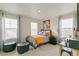 Bedroom with carpet flooring and two large windows at 18813 E 99Th Ave, Commerce City, CO 80022