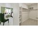 Walk-in closet with built in shelving and carpet at 18813 E 99Th Ave, Commerce City, CO 80022