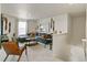 Living room with a gray sectional sofa, coffee table, and airplane-themed decor at 18813 E 99Th Ave, Commerce City, CO 80022