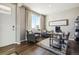Inviting home office featuring plush seating, a large window, and a stylish desk setup at 18813 E 99Th Ave, Commerce City, CO 80022