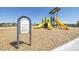 Community playground and informational signage on a wood chip surface at 18813 E 99Th Ave, Commerce City, CO 80022