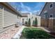 Cozy backyard space between houses with a storage shed, and a small grass lawn at 271 Terra Vista St, Brighton, CO 80601