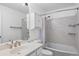 Bright bathroom featuring a stylish vanity, toilet, shower and tub combination, and tiled walls at 271 Terra Vista St, Brighton, CO 80601